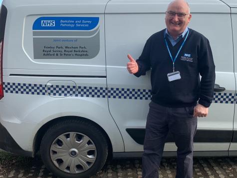 Martin Healy, driver, next to trust van