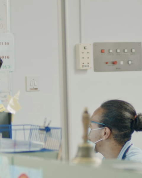 two healthcare supportworkers talking