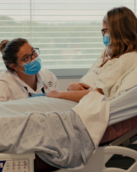 Healthcare support worker with patient