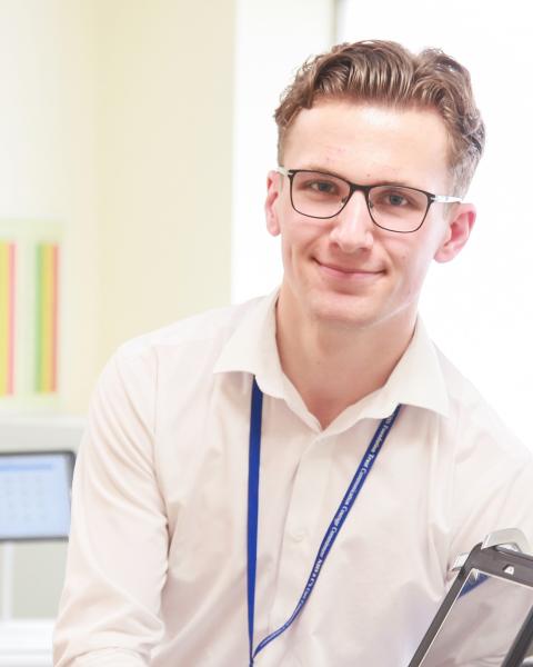 NHS IT technican with tablet