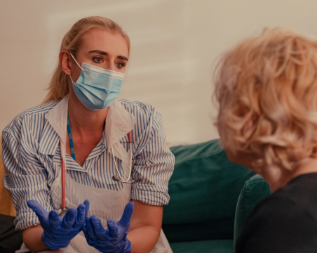occupational therapist talking to patient