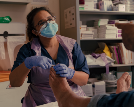 podiatrist with patient