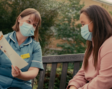 nurse talking to patient