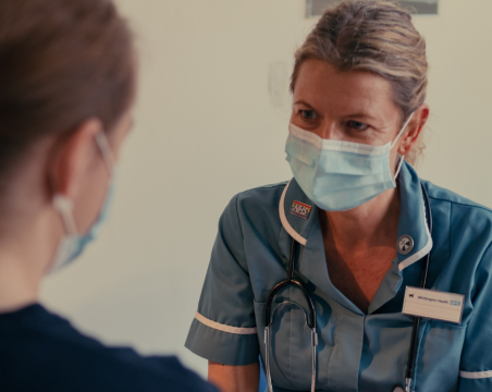 nurse with mask with patient