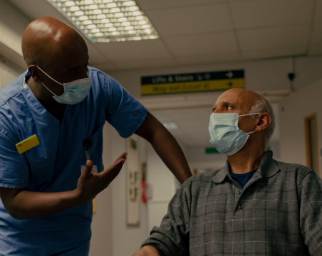 healthcare support worker talking to patient