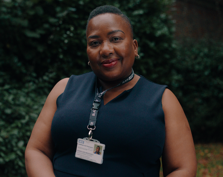 nurse looking at camera Read Khawuleza Gloria's story