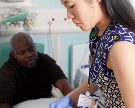 doctor putting on gloves