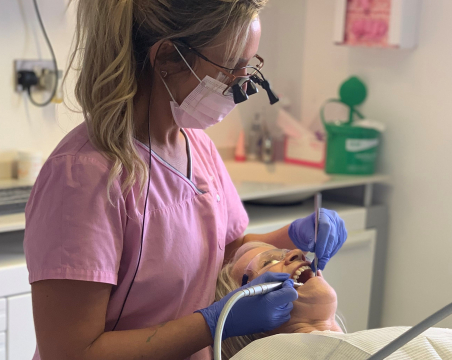 dental hygienist with patient