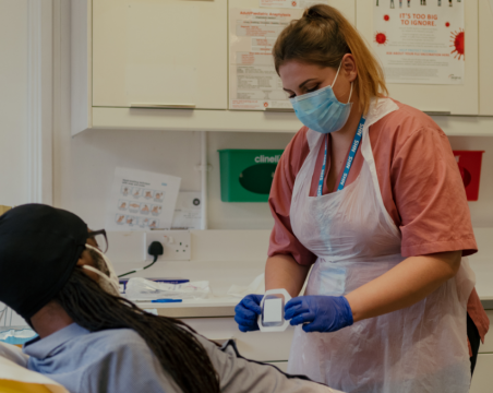 healthcare support worker with patient