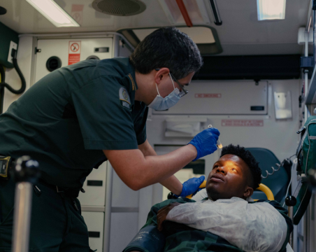 paramedic in ambulance with patient