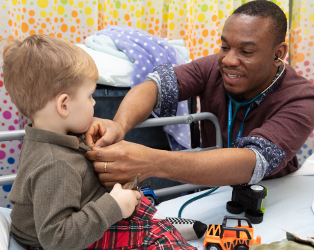 Paediatric registrar with child