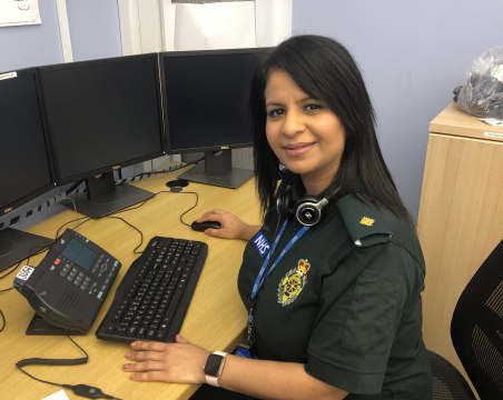 ambulance team leader sitting next to desk