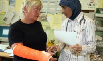 HC - femal doctor with patient in caste