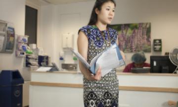 Doctor in Hospital with folder
