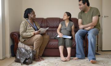 health visitor with parents