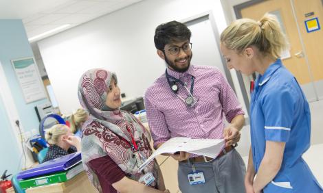 Two doctors and nurse on a ward