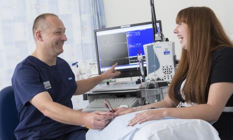 neurophysiologist with patient