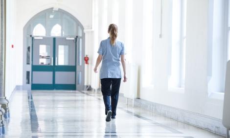 Student nurse walking in corridor Student nurse walking in corridor