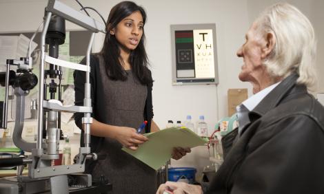 eye doctor with patient eye doctor with patient