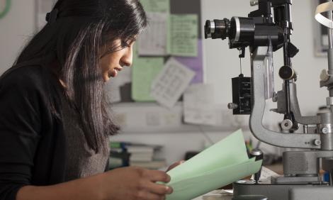 female doctor looking at notes female doctor looking at notes