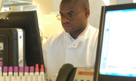 healthcare-science-male-in lab-coat-with-computer