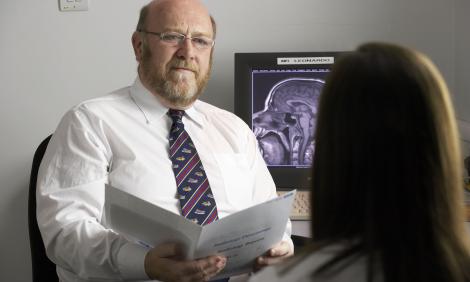 male doctor with patient in office male doctor with patient in office