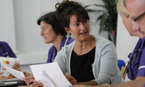 school nurse talking to colleagues 