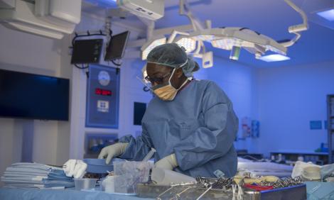 theatre nurse with equipment