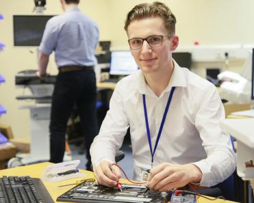 ICT support technician with computer equipment