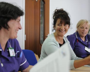 Staff sitting at table