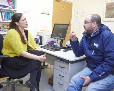 female gp with patient 