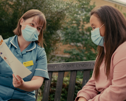 nurse talking to patient