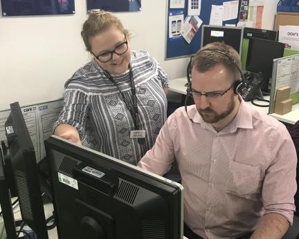 NHS 111 adviser with colleague