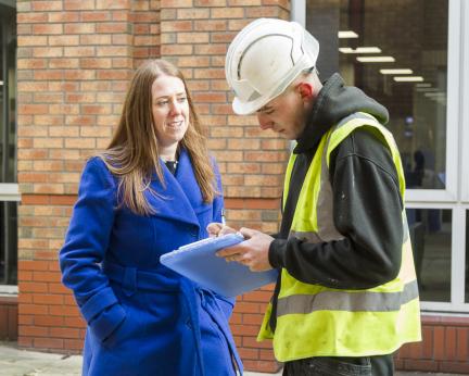 Louise English with building contractor Louise English with building contractor