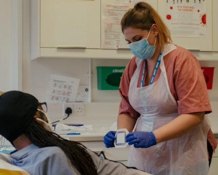 healthcare support worker with patient