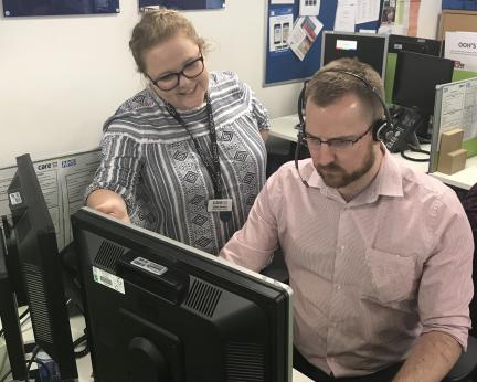 NHS 111 adviser with colleague Read Daisy's story