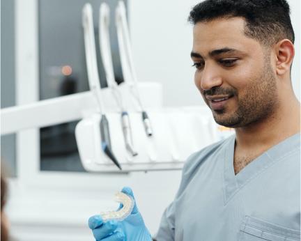 dentist smiling at partient