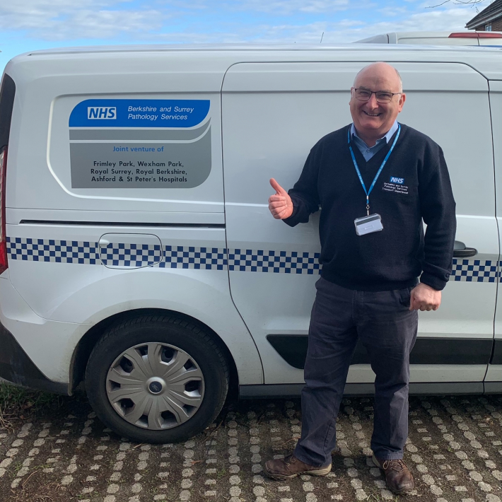 Martin Healy, driver, next to trust van