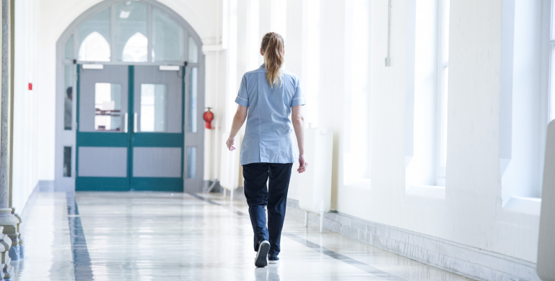 Nursing-nurse-walking-in-corridor.jpg