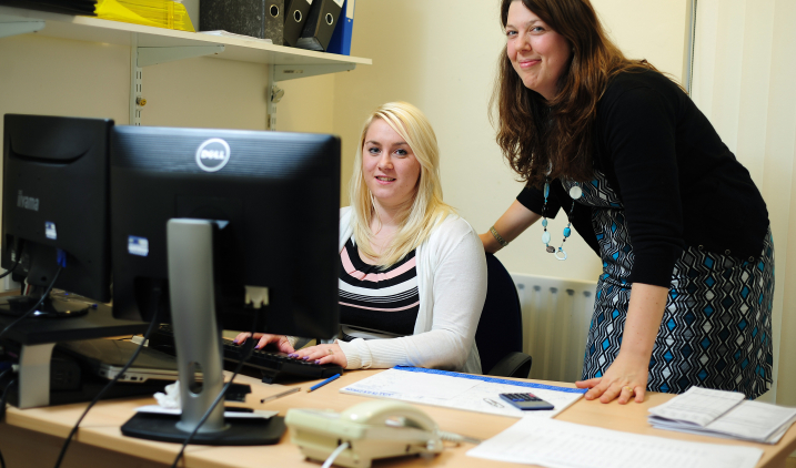 Female office worker with manager Female office worker with manager