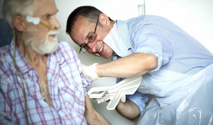 Dietitian injecting a patient 