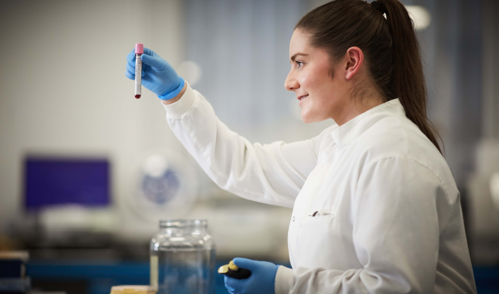 Female healthcare science worker in lab coat