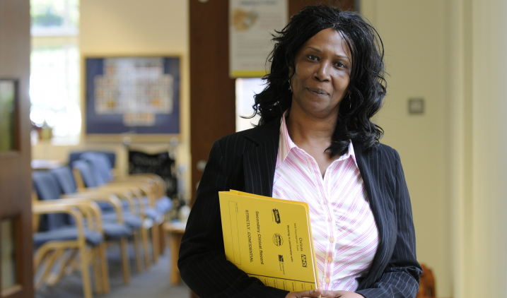 Staff holding folder Staff holding folder