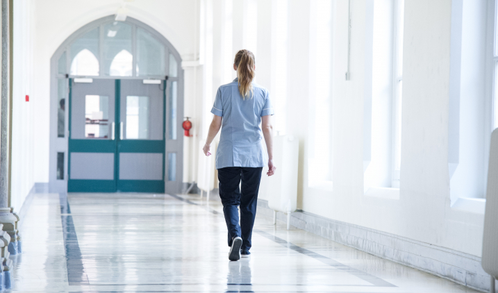 Student nurse walking in corridor