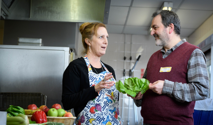 public health manager in conversation with school catering staff