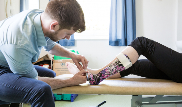 Prosthetist/orthotist with patient Prosthetist/orthotist with patient