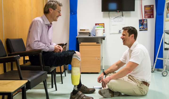 prosthetist laughing with patient prosthetist laughing with patient