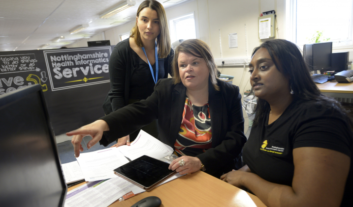 Health informatics trainer with staff Health informatics trainer with staff