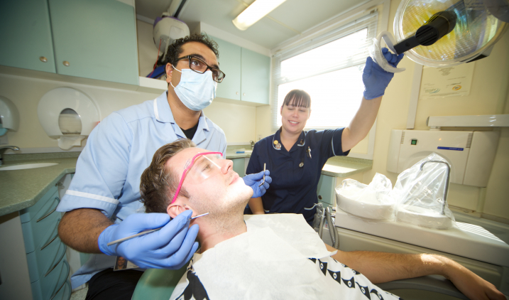 community dentist with patient