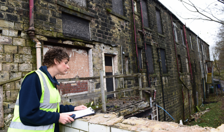 Environmental health professional inspecting housing Environmental health professional inspecting housing
